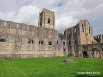 Explore the Fountains Abbey ruins and gardens