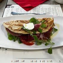 Sip wine and tuck into a piadina at Osteria La Solita Zuppa