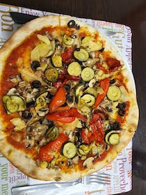 Try the delicious pizza at Casanova Café