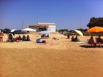 Enjoy beachside drinks at NINOS playa & bebida