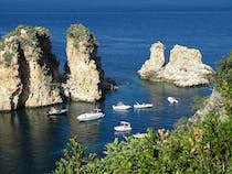 Take in the the scenic Faraglioni di Scopello