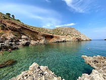 Break away from the crowds at Cala Rossa's secluded beach