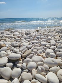 Unwind at Bertolino Park and enjoy a peaceful pebbly beach