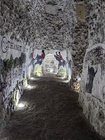 Admire the artistic murals in the Margate Caves