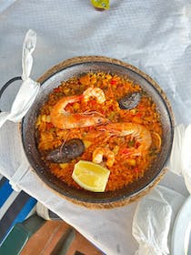Try the seafood paella at Restaurante Las Flores