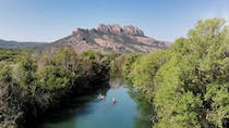 Kayak along a scenic river with La Base Du Rocher