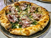 Grab a pizza at AL 384 Pizzeria con Cucina