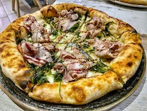 Grab a pizza at AL 384 Pizzeria con Cucina