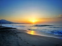 Stroll along Fuengirola's beachfront promenade