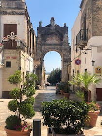 Contemplate the Baroque beauty of Porta Manfredi