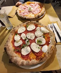 Feast on pizza at Il Cappellaccio
