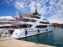 Explore Port Adriano's Yachts, Shops, and Beach