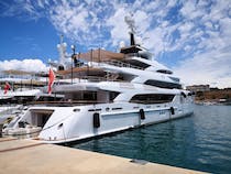 Explore Port Adriano's Yachts, Shops, and Beach