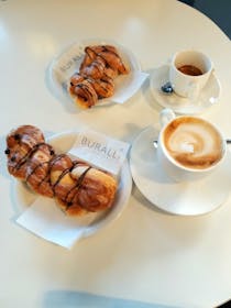 Indulge in Pasticceria Buralli's delightful pastries and coffee