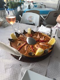 Enjoy paella with a view at Chiringuito Torremuelle Playa