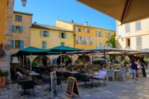 Explore the charming Place des Arcades