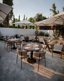 Tuck into a pizza at Roostiq Marbella