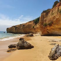 Relax on the sandy shores of Praia Maria Luísa