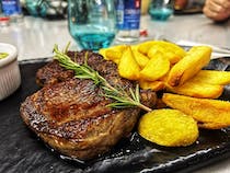 Try the steak at Graces Restaurante