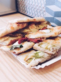 Enjoy authentic pizza at Alice Pizza