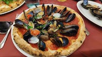 Try the seafood pizza at Il Cuore Di Napoli Ribelle