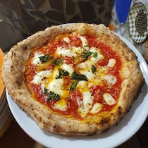 Indulge in authentic Neapolitan pizza at Pizzeria Piccolo Cesare