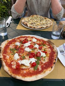 Try the pizza at Pizzeria La Melodia