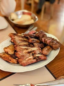 Try the oat-grilled meats at Enoteca Ristorante il Gallo Nero