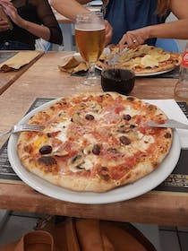 Eat a slice at Pizza & Grill Natola