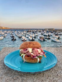 Watch the sunset at Larilò
