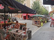 Drink a beer or wine in Taverne de la Butte