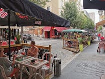 Drink a beer or wine in Taverne de la Butte 