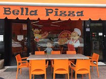 Enjoy delicious pizza at Bella Pizza