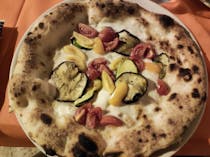 Share a couple of pizzas at La Biga