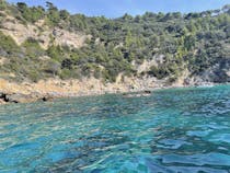 Explore Cala Grande's Rocky Beach