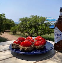 Enjoy a drink by the sea at Al Muretto