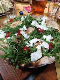 Try the delicious pizza at Pizzeria Zio Bello