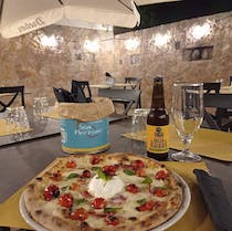 Order a pizza and a beer at Pizzeria San Marzano