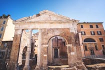 Admire ancient ruins at Portico d'Ottavia