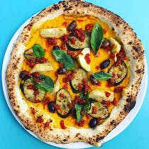 Enjoy delicious wood-fired pizza at Bona