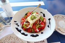 Feast on authentic Greek and Cretan meals at Nick's Koutouki