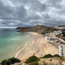 Explore Praia do Burgau's tranquil beauty