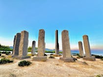 Explore the Time & Space Columns at Cala Llentia