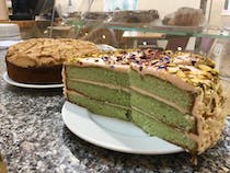 Enjoy a delicious slice of cake at the Grocer Chef