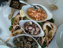 Enjoy fresh seafood at Acácio Restaurant