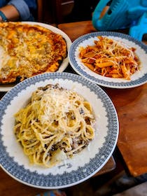 Try the pasta dishes at Berto's Pizza Restaurant