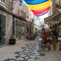 Shop for traditional Portuguese souvenirs at Largo De São Francisco