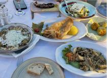 Share an array of dishes at Aristos Fish Restaurant