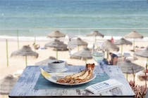 Enjoy a seaside meal at Izzy's Beach Restaurant