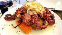 Try the octopus at Três Coroas Restaurant